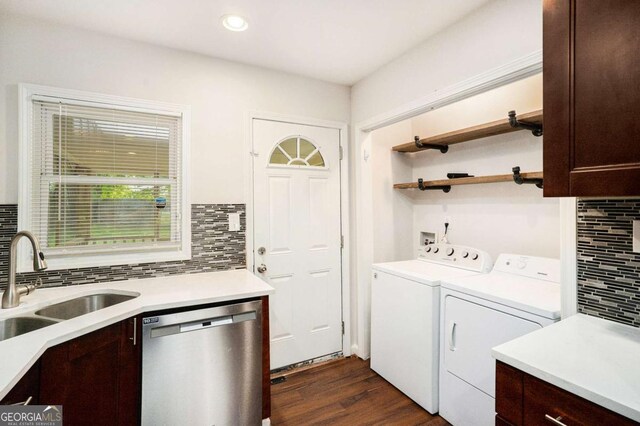 washroom featuring dark wood-style flooring, laundry area, a sink, recessed lighting, and washing machine and dryer