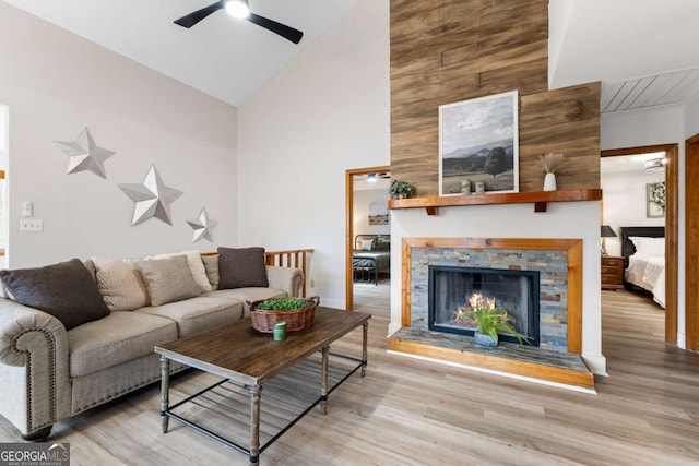 49 Baum Weg, Helen, GA 30545 - living area featuring a ceiling fan, high vaulted ceiling, a lit fireplace, and wood finished floors