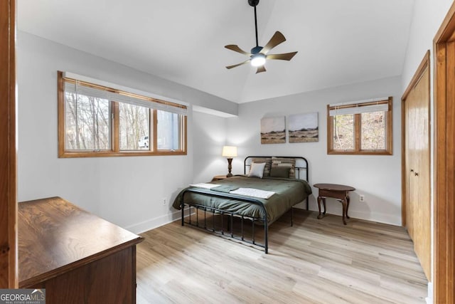 49 Baum Weg, Helen, GA 30545 - bedroom with a closet, baseboards, ceiling fan, light wood-type flooring, and vaulted ceiling