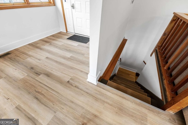 49 Baum Weg, Helen, GA 30545 - staircase with baseboards, wood finished floors, and visible vents