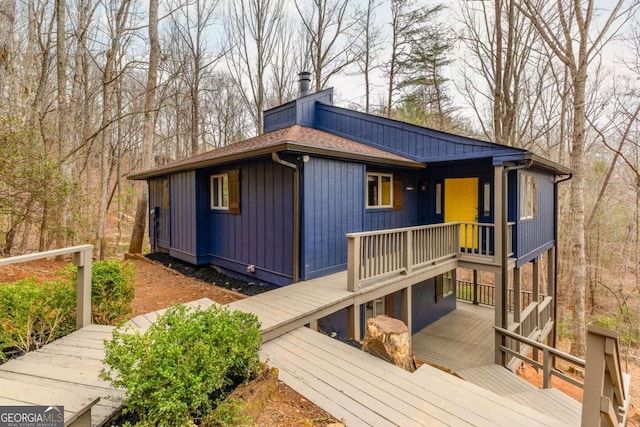49 Baum Weg, Helen, GA 30545 - view of front of property featuring roof with shingles, a chimney, and a deck