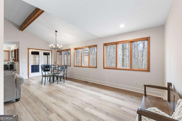 49 Baum Weg, Helen, GA 30545 - dining area featuring baseboards, lofted ceiling with beams, a chandelier, and a healthy amount of sunlight