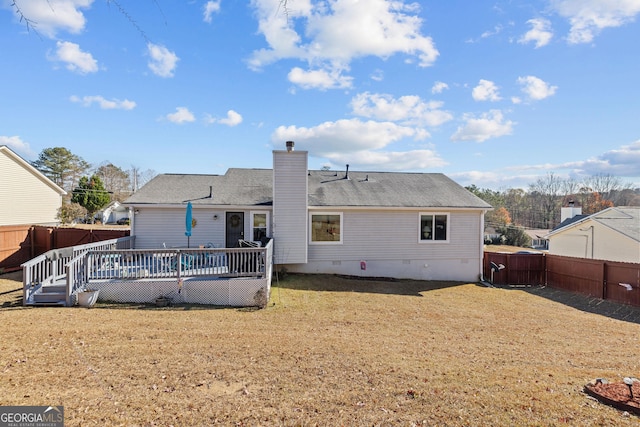 rear view of house featuring crawl space, a chimney, a fenced backyard, and a deck