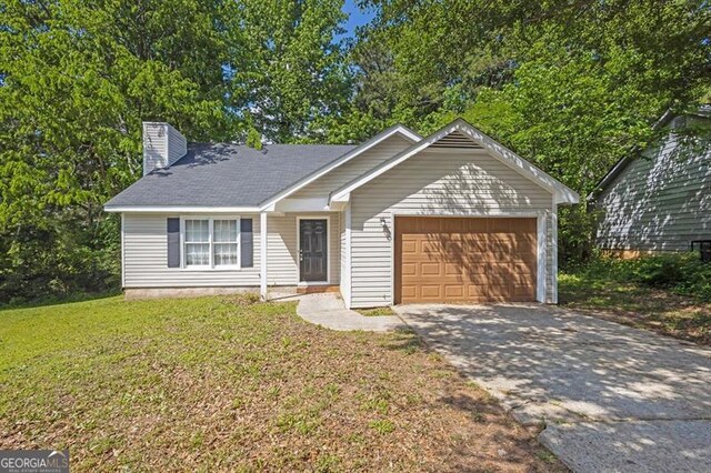 single story home with a garage, driveway, and a chimney