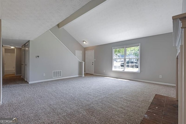 785 Redland Dr, Jonesboro, GA 30238 - unfurnished living room with carpet and a textured ceiling