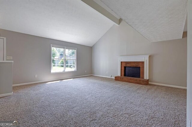 785 Redland Dr, Jonesboro, GA 30238 - unfurnished living room with a textured ceiling, carpet flooring, and a brick fireplace
