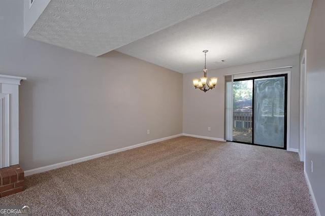 785 Redland Dr, Jonesboro, GA 30238 - empty room featuring a chandelier, carpet flooring, and a textured ceiling