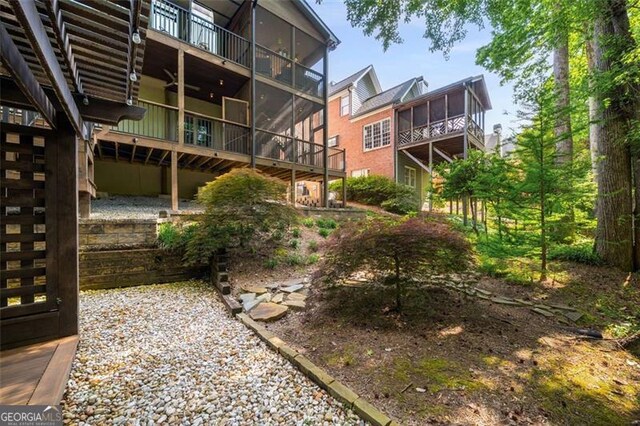 view of yard featuring a sunroom