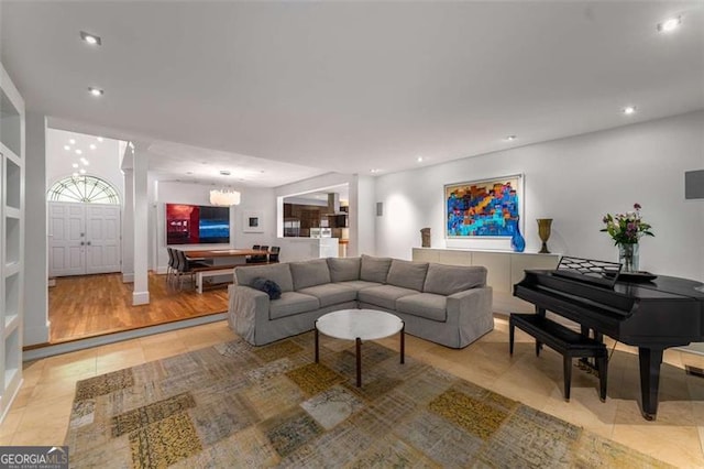 living area featuring light tile patterned floors and recessed lighting