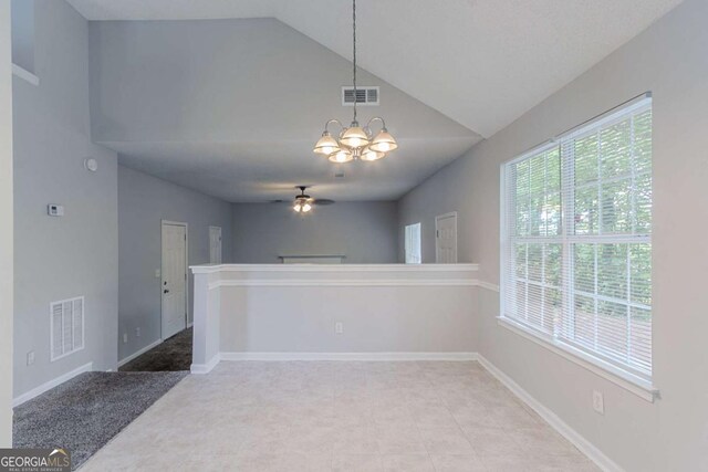2319 Rambling Way, Lithonia, GA 30058 - empty room featuring a ceiling fan, a chandelier, and high vaulted ceiling