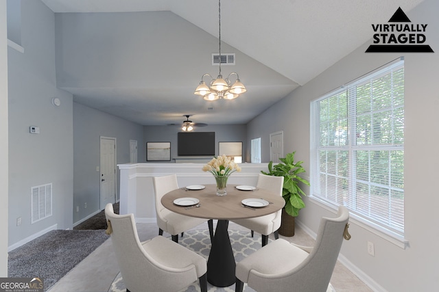 2319 Rambling Way, Lithonia, GA 30058 - dining room featuring ceiling fan, a chandelier, and high vaulted ceiling