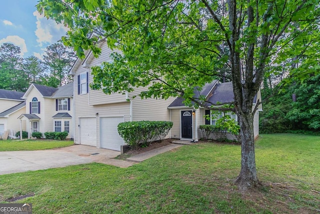 view of front of house featuring a garage, a front lawn, and driveway