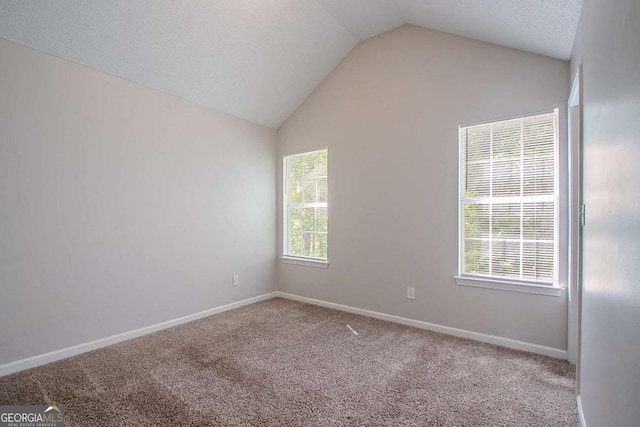 2319 Rambling Way, Lithonia, GA 30058 - empty room with lofted ceiling and carpet floors
