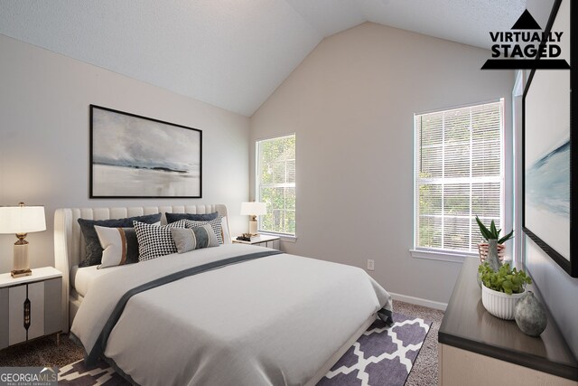 2319 Rambling Way, Lithonia, GA 30058 - carpeted bedroom with lofted ceiling and multiple windows