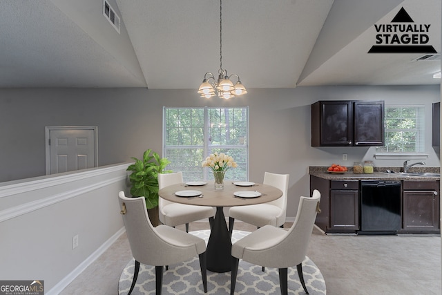 2319 Rambling Way, Lithonia, GA 30058 - dining area featuring a chandelier and vaulted ceiling