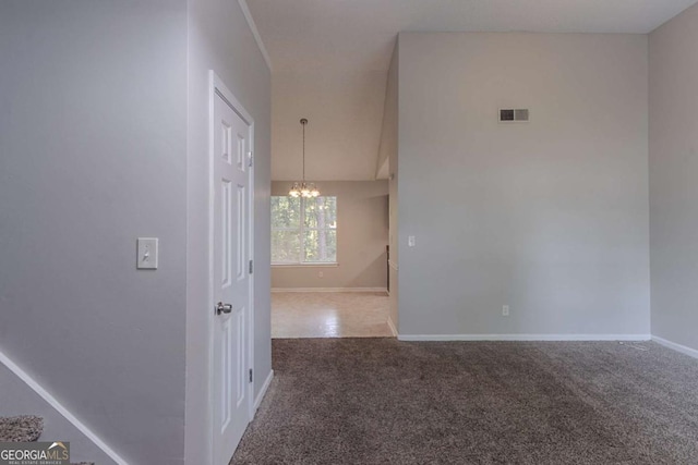 2319 Rambling Way, Lithonia, GA 30058 - carpeted spare room featuring a chandelier and baseboards