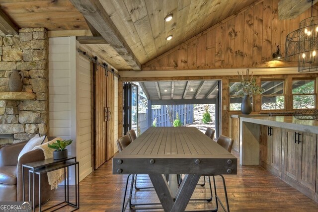sunroom / solarium with a barn door