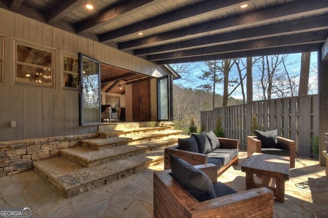 view of patio / terrace with fence and an outdoor hangout area