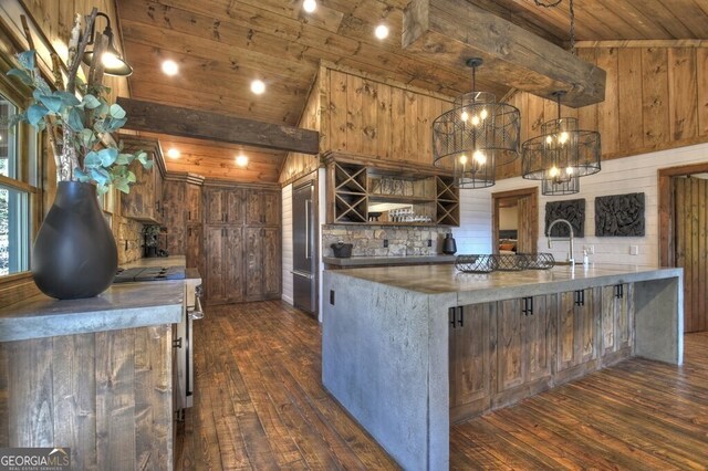 kitchen featuring stainless steel appliances, dark wood finished floors, wooden ceiling, and vaulted ceiling