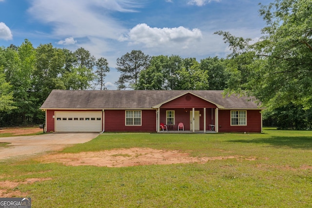 ranch-style home with a garage, a porch, driveway, and a front yard