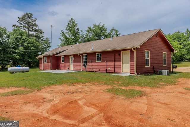 1170 Peeksville Rd, Locust Grove, GA 30248 - rear view of house with a patio, a yard, and central AC