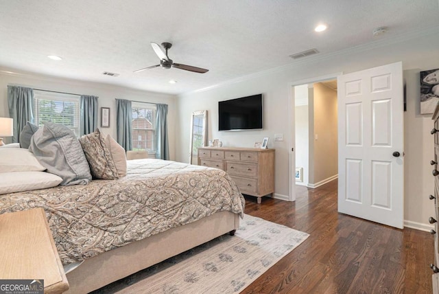 bedroom with baseboards, ornamental molding, and visible vents