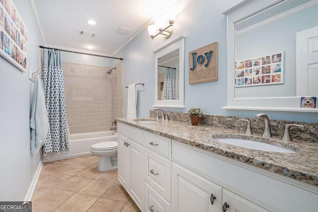 bathroom featuring crown molding, double vanity, a sink, and tile patterned flooring