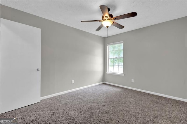 1774 Northwick Pl, Lithonia, GA 30058 - carpeted empty room with baseboards and ceiling fan