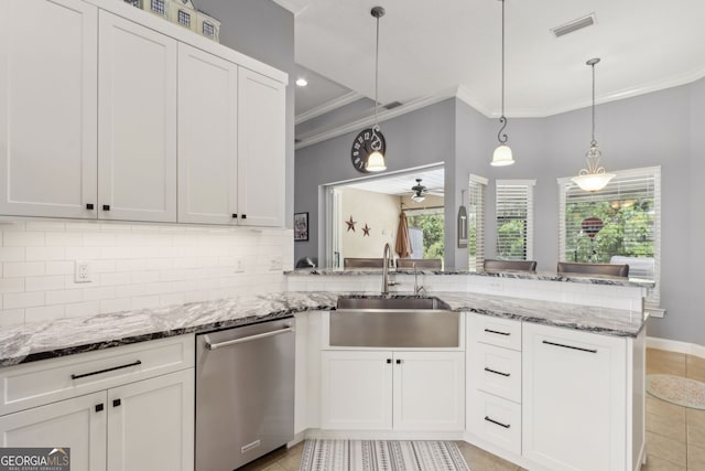 kitchen with crown molding, white cabinets, a sink, dishwasher, and decorative backsplash