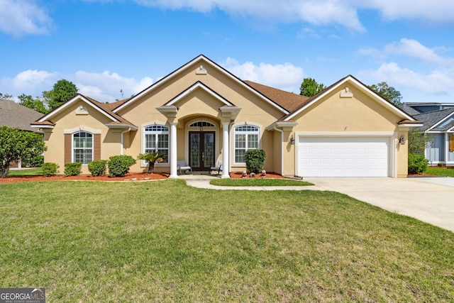 ranch-style house featuring a garage, stucco siding, a front yard, concrete driveway, and french doors