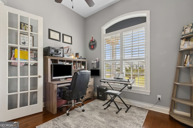 office area featuring baseboards, ceiling fan, and wood finished floors