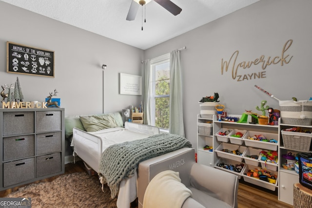 bedroom featuring a ceiling fan and wood finished floors