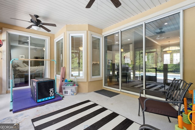 exterior space featuring ceiling fan