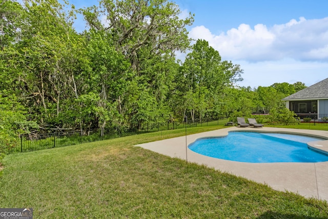 view of pool with fence, a fenced in pool, a yard, and a patio