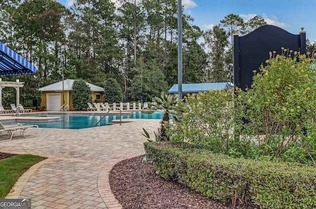 pool with a patio area
