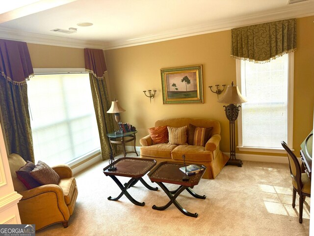 carpeted living room with baseboards, ornamental molding, visible vents, and a wealth of natural light