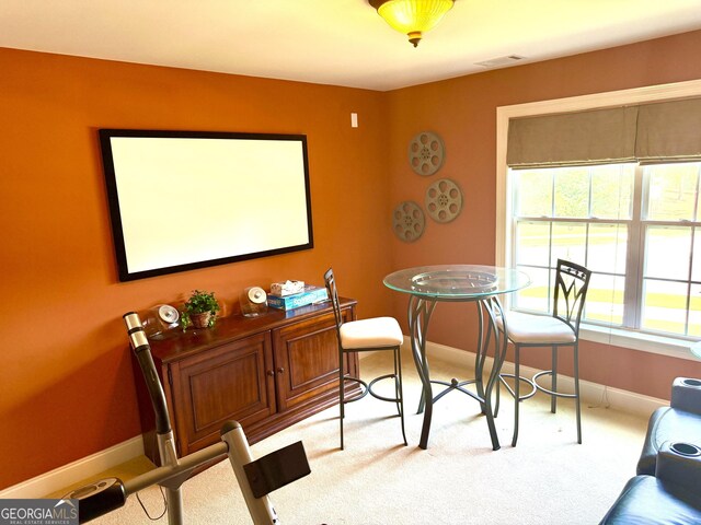 office area featuring carpet floors, baseboards, and visible vents