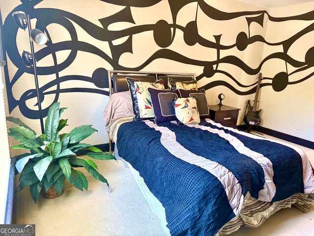 carpeted bedroom featuring baseboards