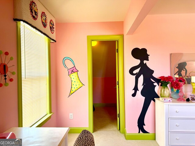 bedroom featuring baseboards and carpet