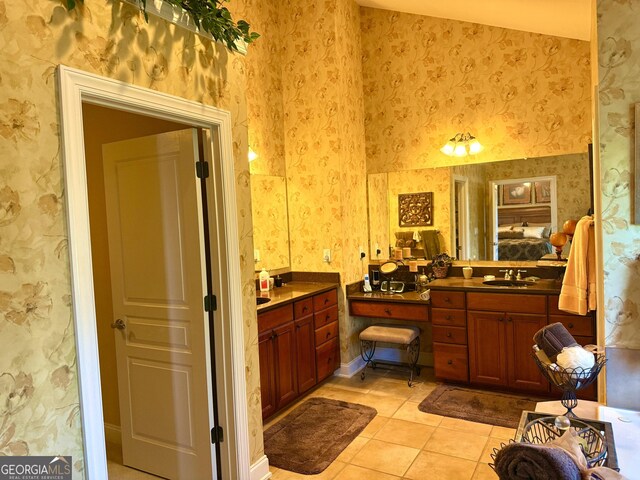bathroom featuring wallpapered walls, tile patterned floors, and vanity