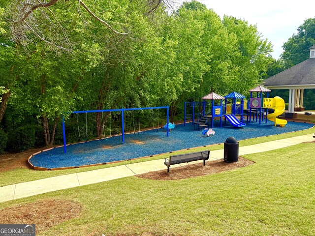 community jungle gym with a lawn