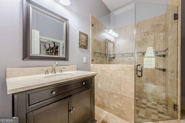 full bathroom featuring vanity and a stall shower
