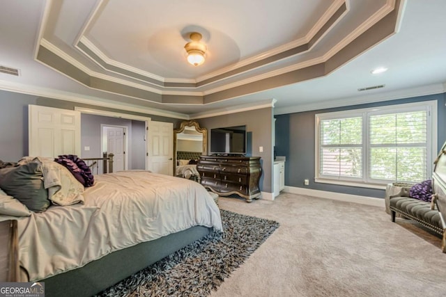 carpeted bedroom featuring visible vents, ornamental molding, a ceiling fan, and a tray ceiling