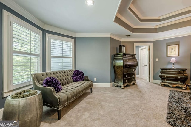 living room with baseboards, ornamental molding, and carpet