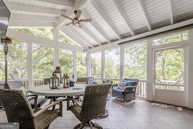 sunroom / solarium with plenty of natural light, outdoor dining space, and ceiling fan