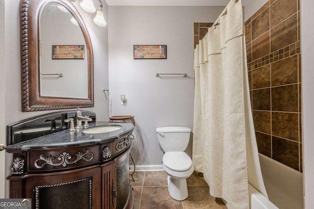 bathroom with tile patterned flooring, vanity, toilet, baseboards, and shower / tub combo