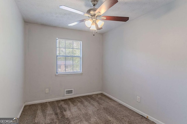 5723 Fieldstone Dr, Lithonia, GA 30038 - carpeted spare room with baseboards, a textured ceiling, visible vents, and a ceiling fan