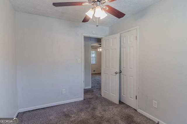 5723 Fieldstone Dr, Lithonia, GA 30038 - unfurnished bedroom featuring a closet, a textured ceiling, ceiling fan, carpet floors, and baseboards