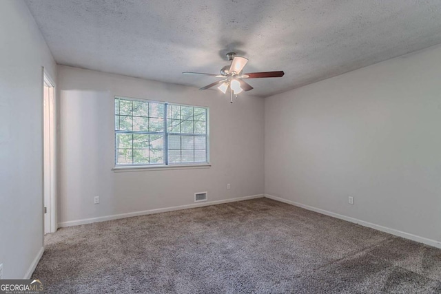 5723 Fieldstone Dr, Lithonia, GA 30038 - empty room featuring carpet, a textured ceiling, baseboards, ceiling fan, and visible vents