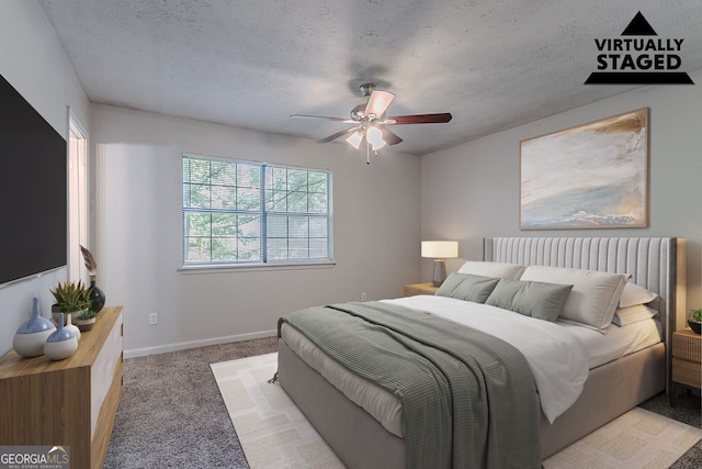 5723 Fieldstone Dr, Lithonia, GA 30038 - carpeted bedroom with baseboards, ceiling fan, and a textured ceiling